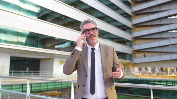 Mature Businessman Laughing Phone Call Modern Urban Landscape His Relaxed — Stock Video