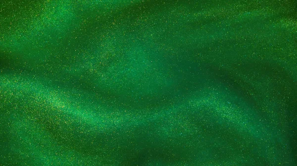 Abstract green background with golden sparkles. Photo of a green liquid with different depth of field and gold glitters. Different shades of green with golden splashes.