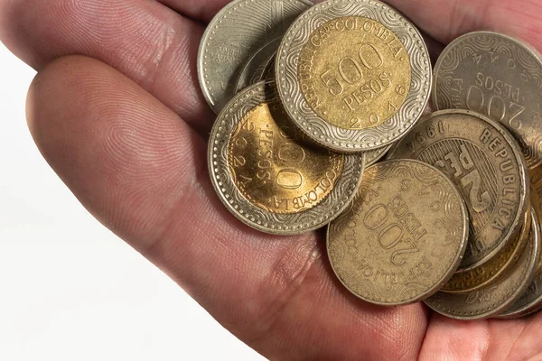 Männerhand Mit Kolumbianischen Münzen — Stockfoto