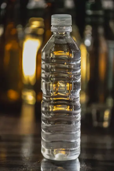 Plastic bottle with water differential focus