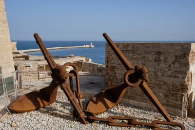 large anchors in the coast in the port area near the Valletta district in Malta
