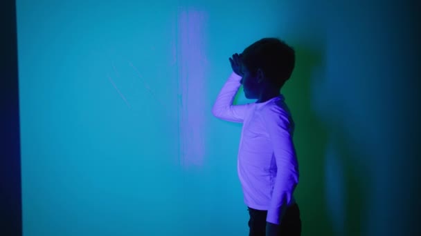 Boy Having Fun Playroom Colored Lights Playing Shadows — Stock Video
