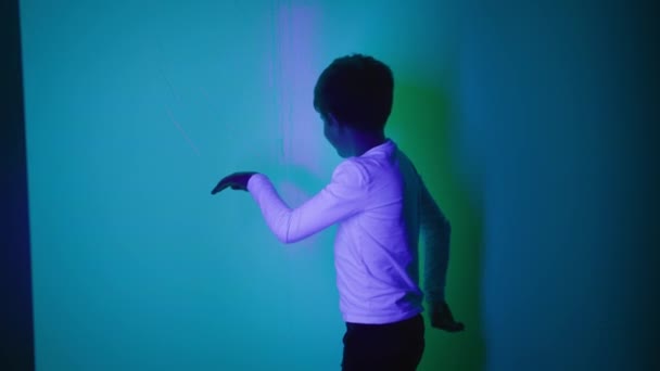 Happy Male Child Having Fun Playing Lights Shadows Interactive Room — Stock Video