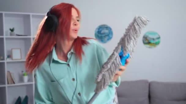 Charming Young Housewife Mop Hands Dances Sings Merrily While Cleaning — Vídeo de Stock