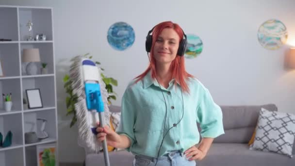 Portrait Young Woman Headphones Mop Hands Has Fun Spending Time — стоковое видео