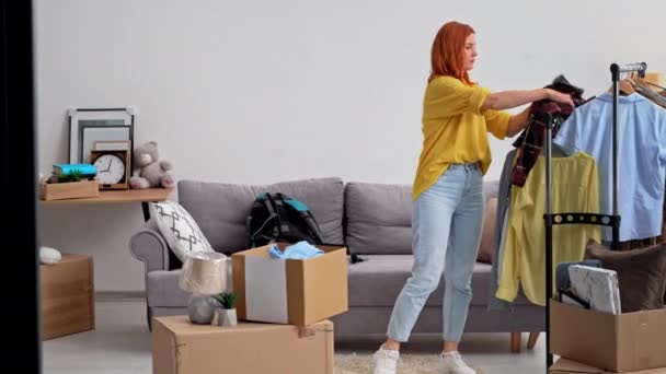 Refugees Weary Woman Collects Necessary Clothes Leave Her Home City — Stock Video