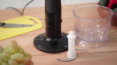 modern blender for cooking and grinding food on kitchen table, close-up
