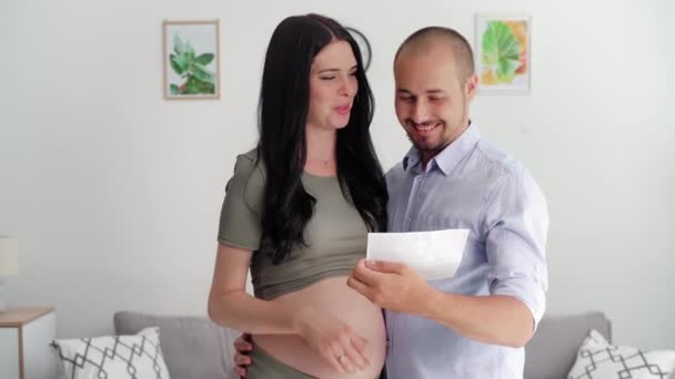 Happy Man Together Pregnant Woman Looking Photo Ultrasound Hands Smiling — Video