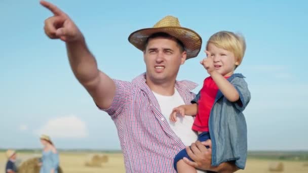 Fatherhood Caring Male Parent Holds Little Boy His Arms Points — Stock Video