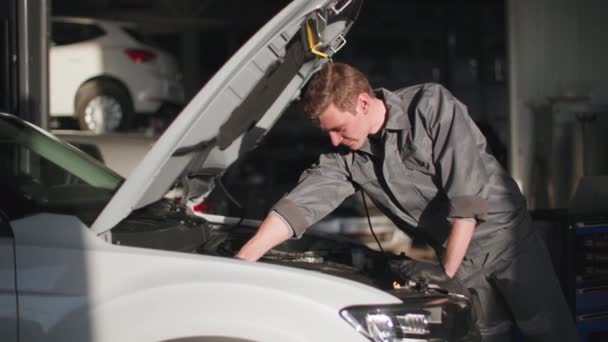 Young Professional Mechanic Uniform Wrench Hands Looks Engine Hood Car — Stock Video