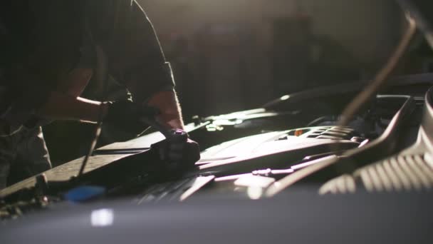 Car Service Professional Male Mechanic Uniform Repairs Motor Hood Wrench — Stock Video