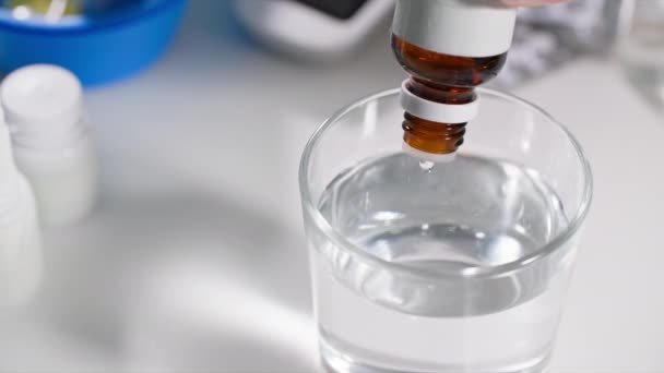 Normalization Pressure Woman Drips Drops Bottle Dispenser Transparent Glass Water — Stock Video