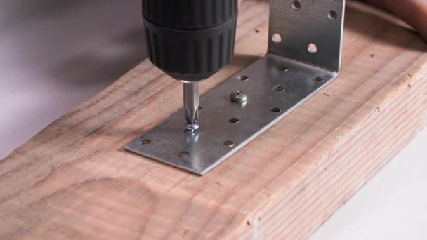Woodworker Male Carpenter Using Drill Screwdriver Screwing Metal Corner Wooden — Stock Video