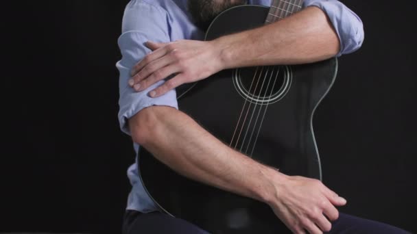 Musical Instrument Young Man Sits Guitar His Hands Dark Background — Stock Video