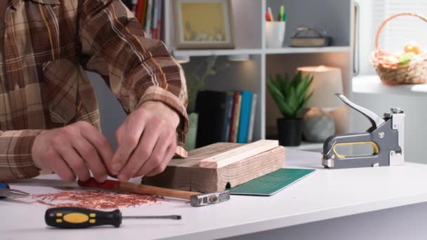 Man Hammers His Hands Nailing Wooden Board Bar Using Nails — Stock Video