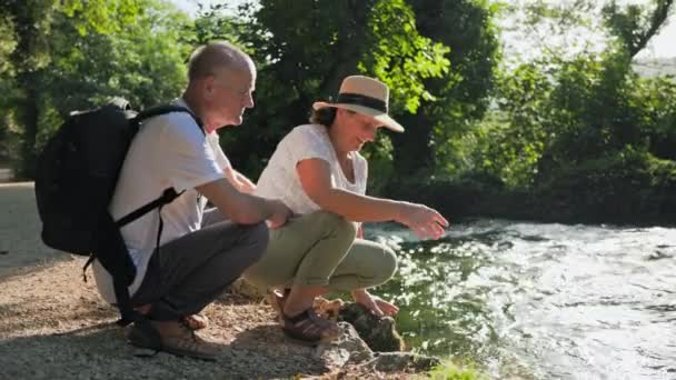 Retirement Travel Joyful Old Couple Having Fun River Splashing Water — Stock Video