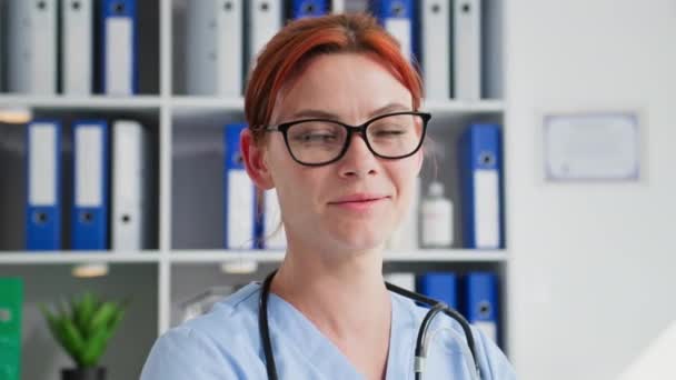 Portrait Female Medical Worker Wearing Glasses Medical Office Smiling Looking — Stock Video