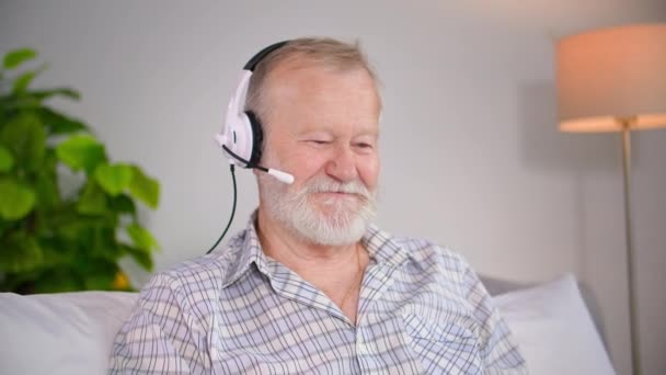 Charming Elderly Man Headset Uses Video Calling Laptop Communicate Old — Stock Video