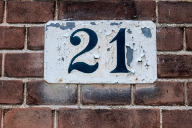 Damaged Close Up House Number 21 At Amsterdam The Netherlands 3-9-2022 clipart