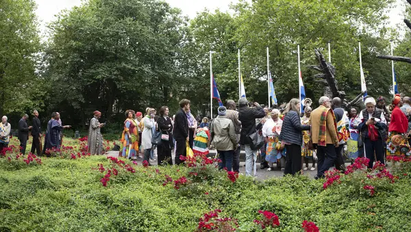 stock image Crowd Passing The Slavery Monument At The Keti Koti Festival At Amsterdam The Netherlands 1-7-2024