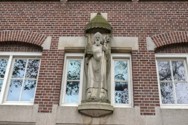 stock image Statue On The Sint Canisius Patronaat Building At Amsterdam The Netherlands 24-5-2024