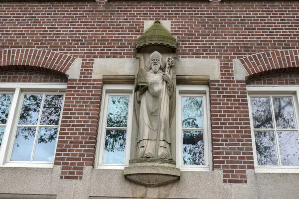 Stock image Statue On The Sint Canisius Patronaat Building At Amsterdam The Netherlands 24-5-2024