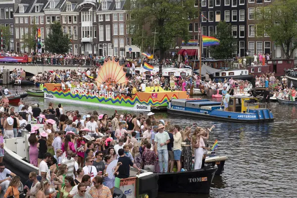 stock image Proud By LGBTQIA+ Netwerk Deloitte Gaypride Canal Boat Parade At Amsterdam The Netherlands 3-8-2024