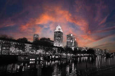 A Red Skyline Around The Amstel River At Amsterdam The Netherlands 2-11-2024 clipart