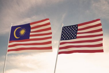 Amerika Birleşik Devletleri ve MALAYSIA arasındaki ilişkiler bulutlu bir gökyüzü görüntüsüne karşı iki bayrak sallanması konseptiyle temsil edilmektedir..