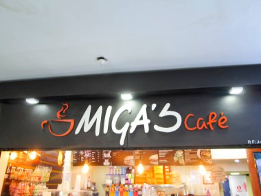 Miga 'nın Kafesi, kahve, tatlı ve diğer yemek türlerini satan bir restorandır. Editör illüstrasyonları, başyazı işleri. Caracas, Venezuela 16 Mayıs 2025.