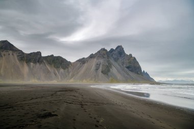 Beautiful sandy beach dominated by Vestrahorn mountain, one of the symbols in Iceland clipart