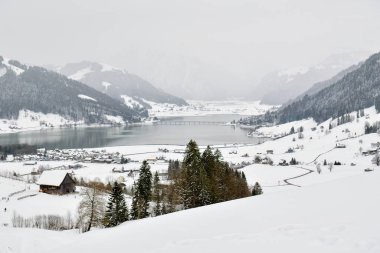 Einsiedeln, Switzerland - March 21, 2021: View on winter Sihlsee lake near Einsiedeln in Switzerland during late winter in March 2021 clipart