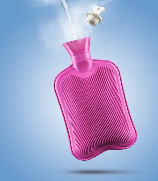 Filling hot water bottle with steam and stopper on blue background.