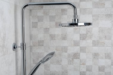 Water running from shower head in bathroom