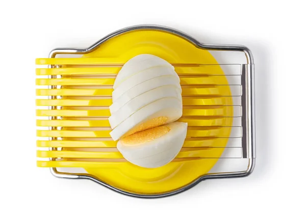 stock image Boiled egg in the egg slicer isolated on a white background