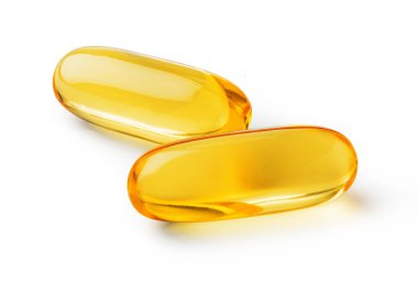 Beyaz zemin üzerinde izole edilmiş omega 3, 6, 9 vitaminli jelatin kapsülü.