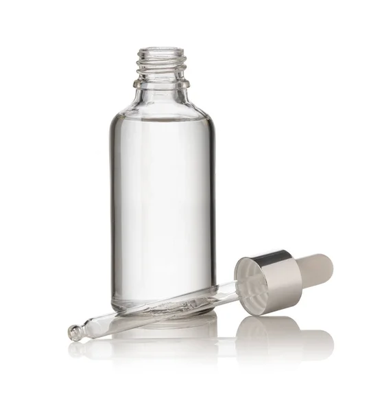 Vallen Van Een Pipet Een Cosmetische Fles Geïsoleerd Witte Achtergrond — Stockfoto