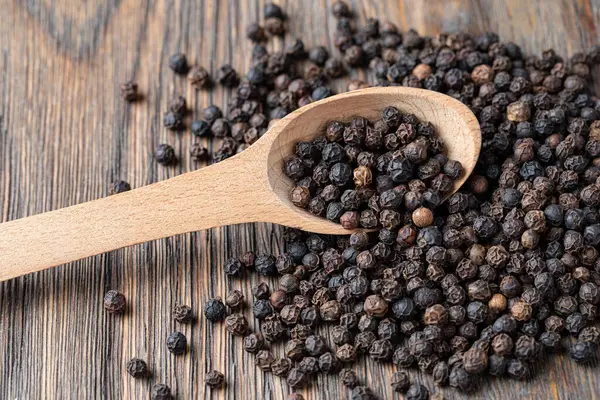 Black Pepper Wooden Spoon Royalty Free Stock Images
