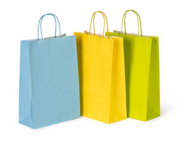 Canlı kağıt alışveriş torbaları, tüketim ve perakende terapiyi sembolize ederek satın almaya hazır bekliyor.