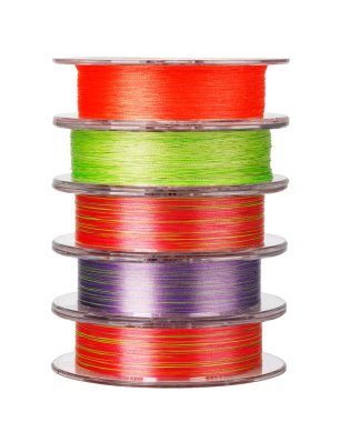 Spools of vibrant fishing lines stacked, creating a colorful pyramid against a white background