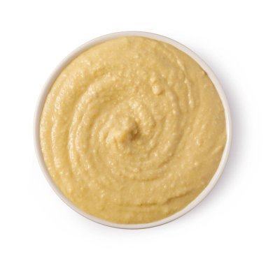 Classic hummus dip swirling in a white bowl, captured from above