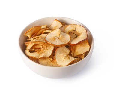 Bowl filled with oven-dried apple chips, a wholesome and natural fruit snack