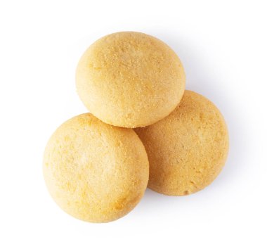 Shortbread cookies stacked on white surface presenting a simple baked sweet treat