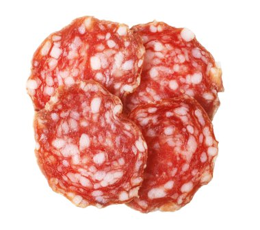 Salami slices presenting a textured pattern, ready to eat