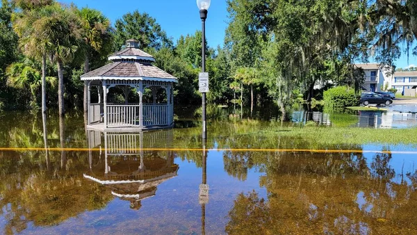 Hurricane Ian flooded houses in Orlando Florida UCF residential area. Natural disaster with totality lost.  Gazebo structure photo taken 9/30/2022