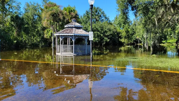 Hurricane Ian flooded houses in Orlando Florida UCF residential area. Natural disaster with totality lost.  Gazebo structure photo taken 9/30/2022