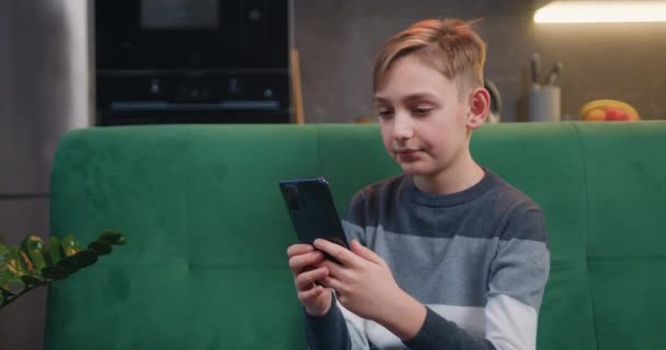 Portrait Little Boy Using Smartphone Watching Screen Reading Typing Playing — Stockvideo