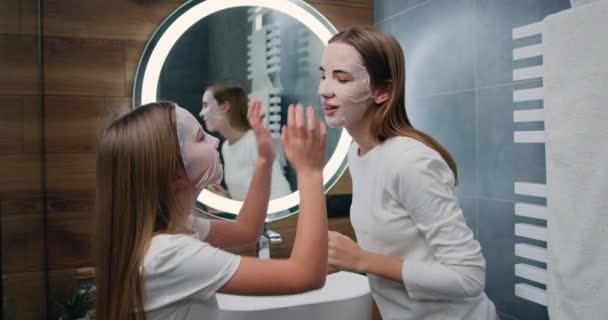 Girl Her Sister Beauty Product Skincare While Modern Bathroom Family — 图库视频影像