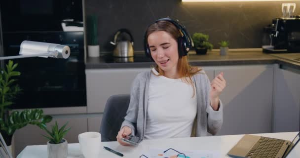 Happy Relaxed Woman Freelancer Dancing Sitting Laptop Wearing Headphones Listening — Stock Video