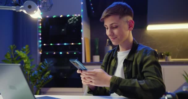 Teenager Boy Sitting Table Holding Smartphone Enjoying Using Mobile Apps — Stock Video